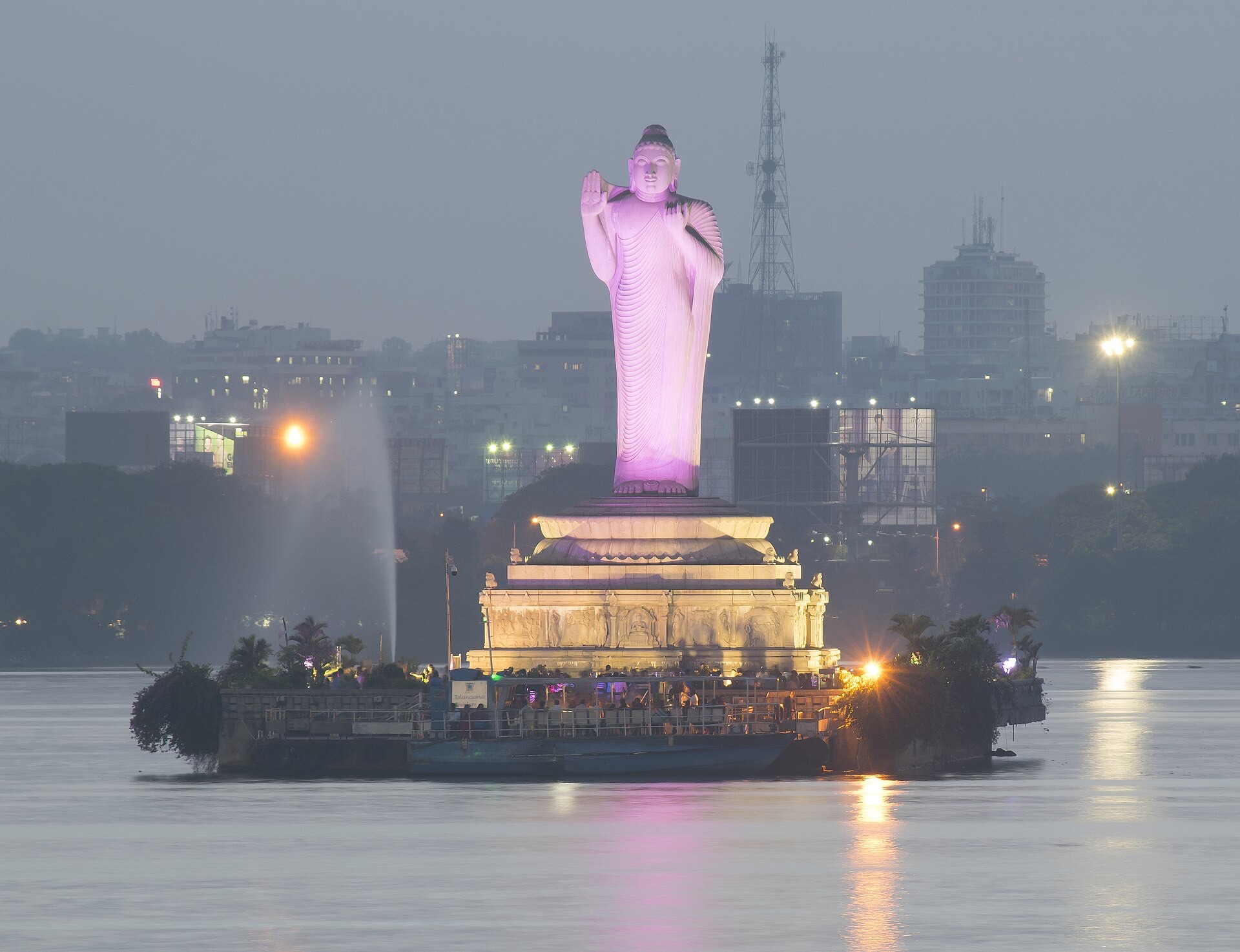 A stone statue of the seated Buddha